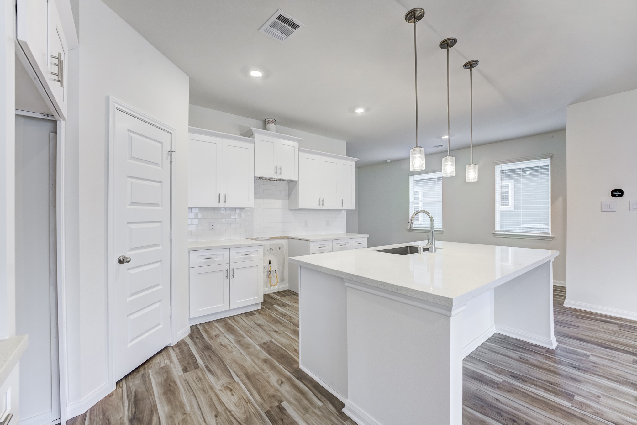 20646 Dynamic Court Humble, TX 77338 - Photo 11 of 40 a large kitchen with kitchen island a sink stainless steel appliances and cabinets