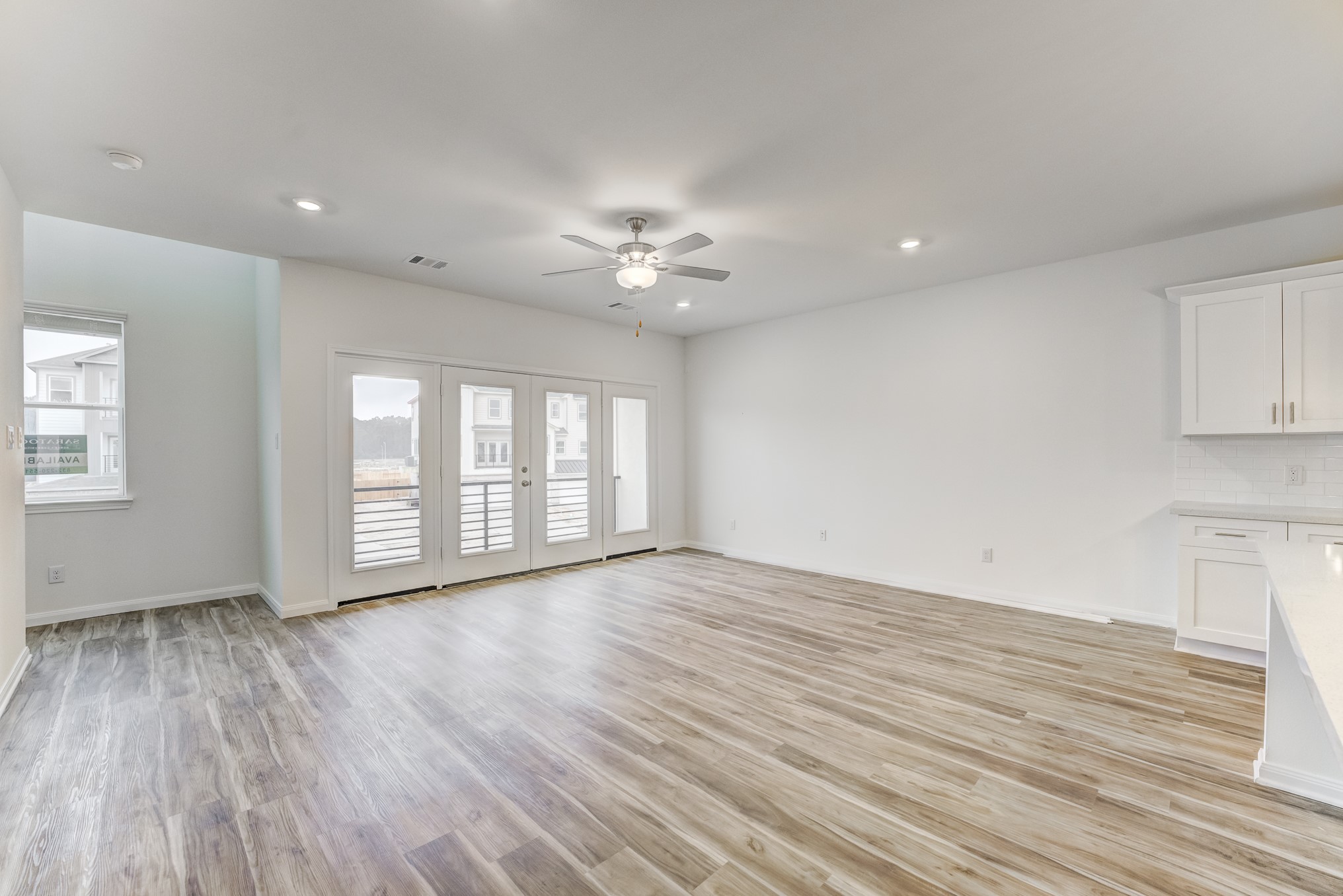 20646 Dynamic Court Humble, TX 77338 - Photo 13 of 40 a view of an empty room with a window and wooden floor