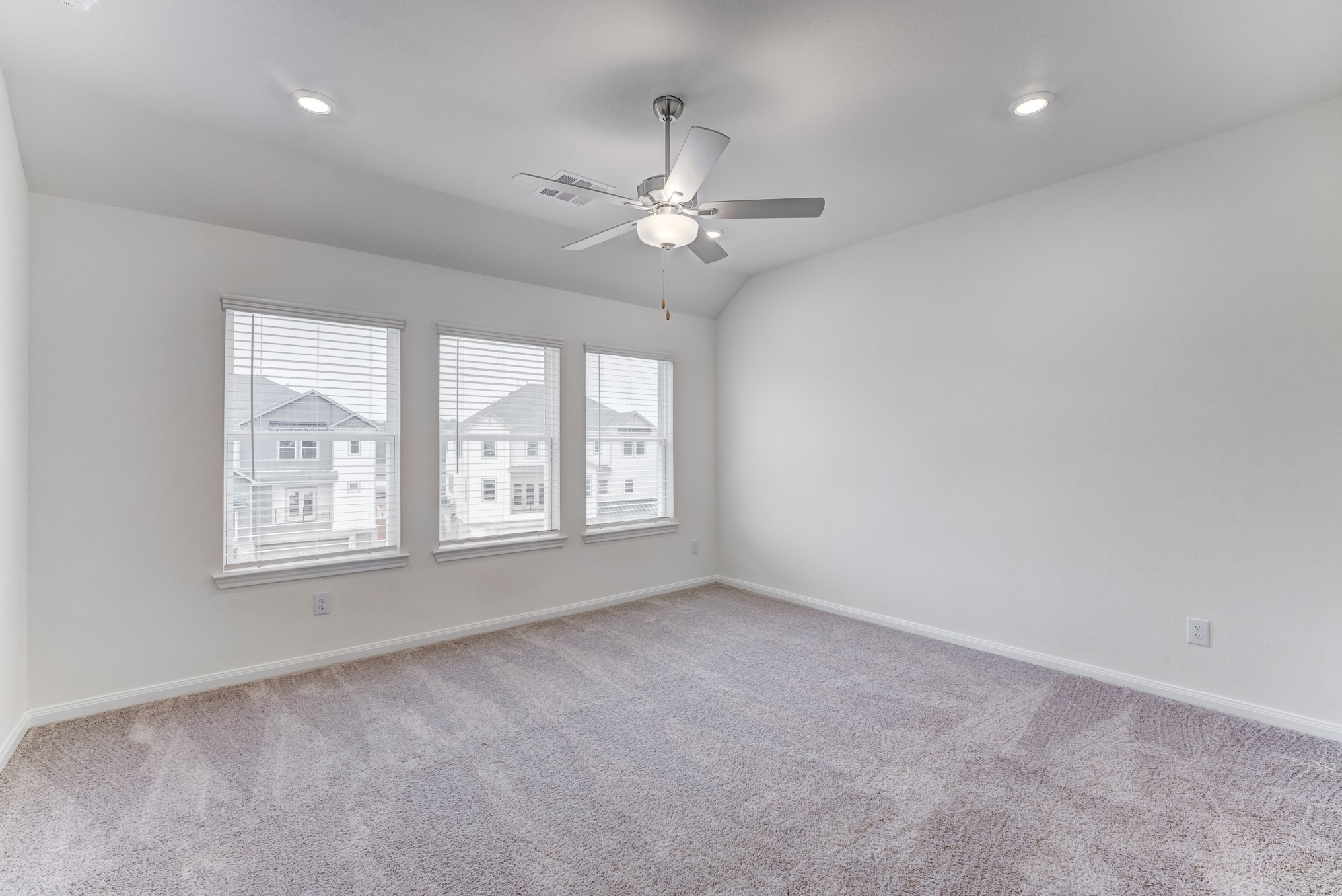 20646 Dynamic Court Humble, TX 77338 - Photo 21 of 40 an empty room with chandelier fan and windows