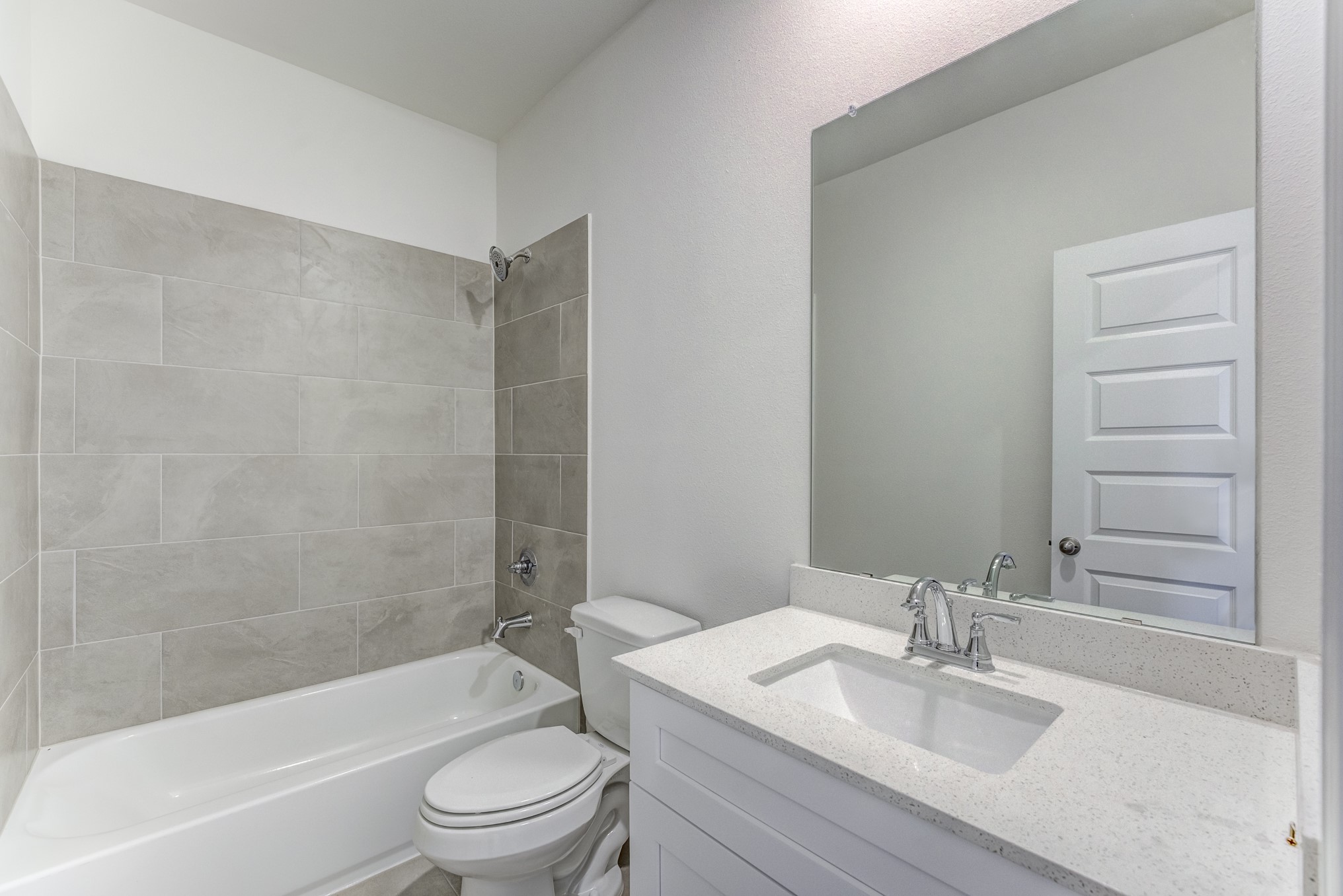 20646 Dynamic Court Humble, TX 77338 - Photo 28 of 40 a bathroom with a granite countertop bathtub shower sink vanity mirror and toilet