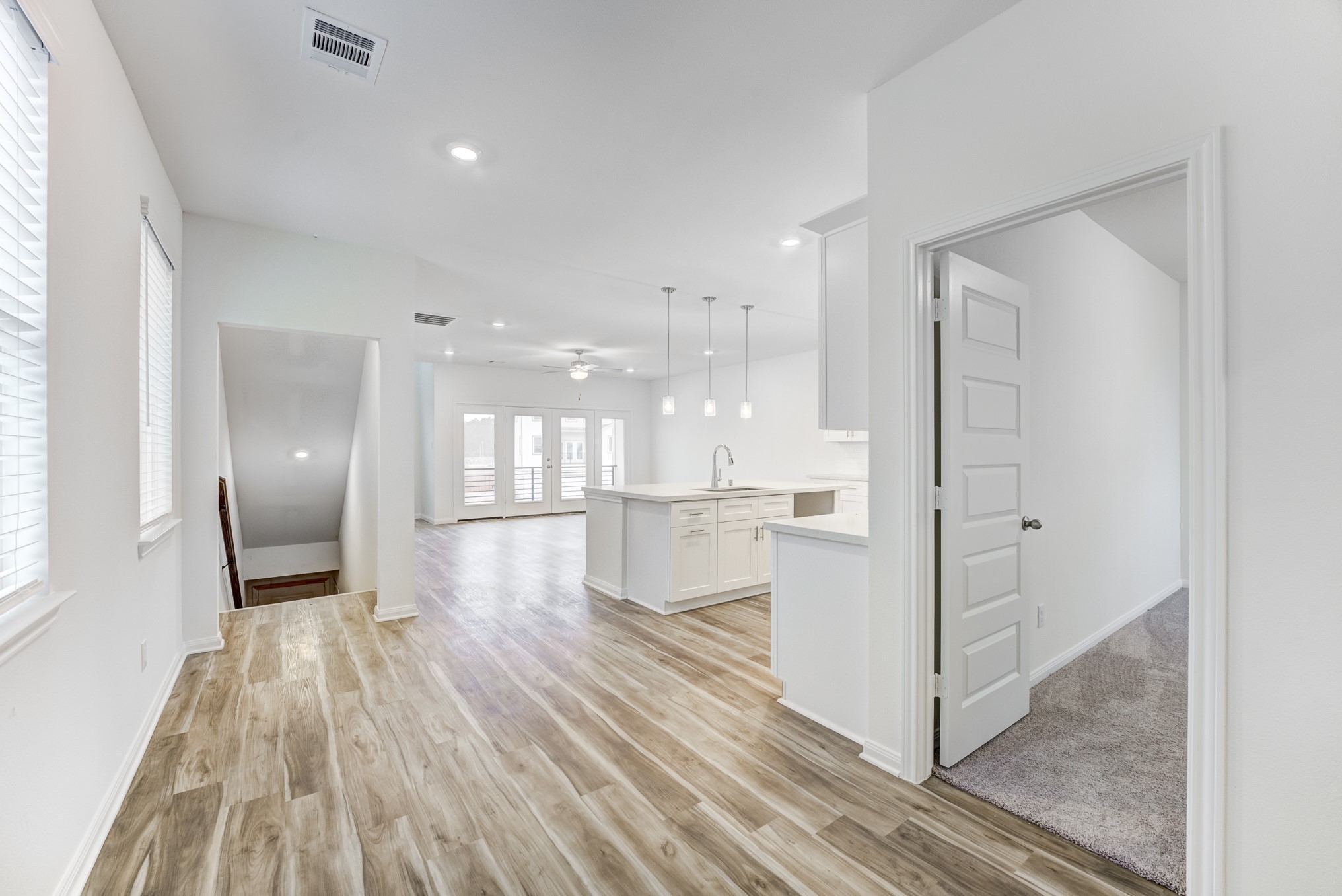 20646 Dynamic Court Humble, TX 77338 - Photo 5 of 40 a view of a hallway with wooden floor windows and staircase