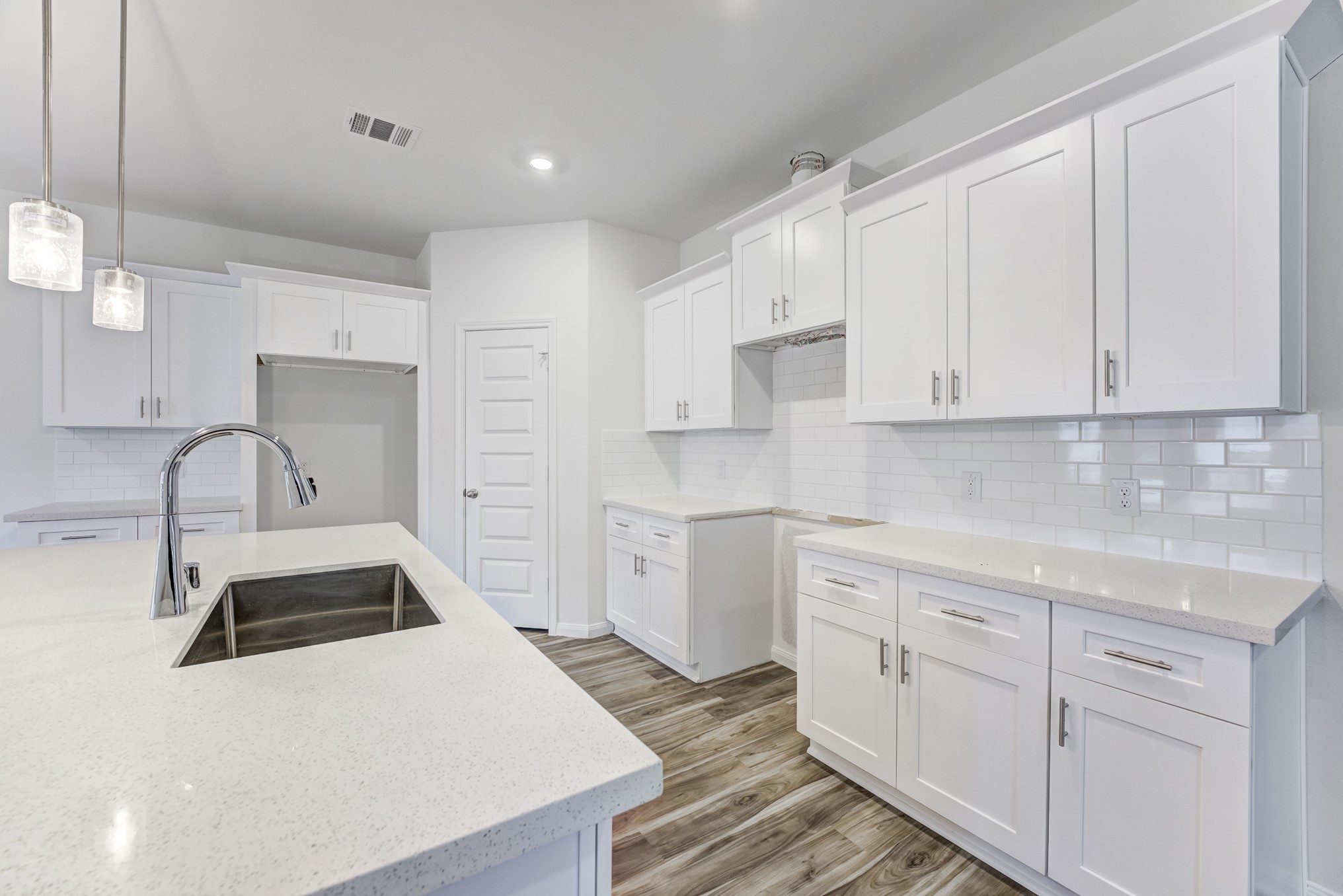 20646 Dynamic Court Humble, TX 77338 - Photo 8 of 40 a kitchen with granite countertop white cabinets and white appliances