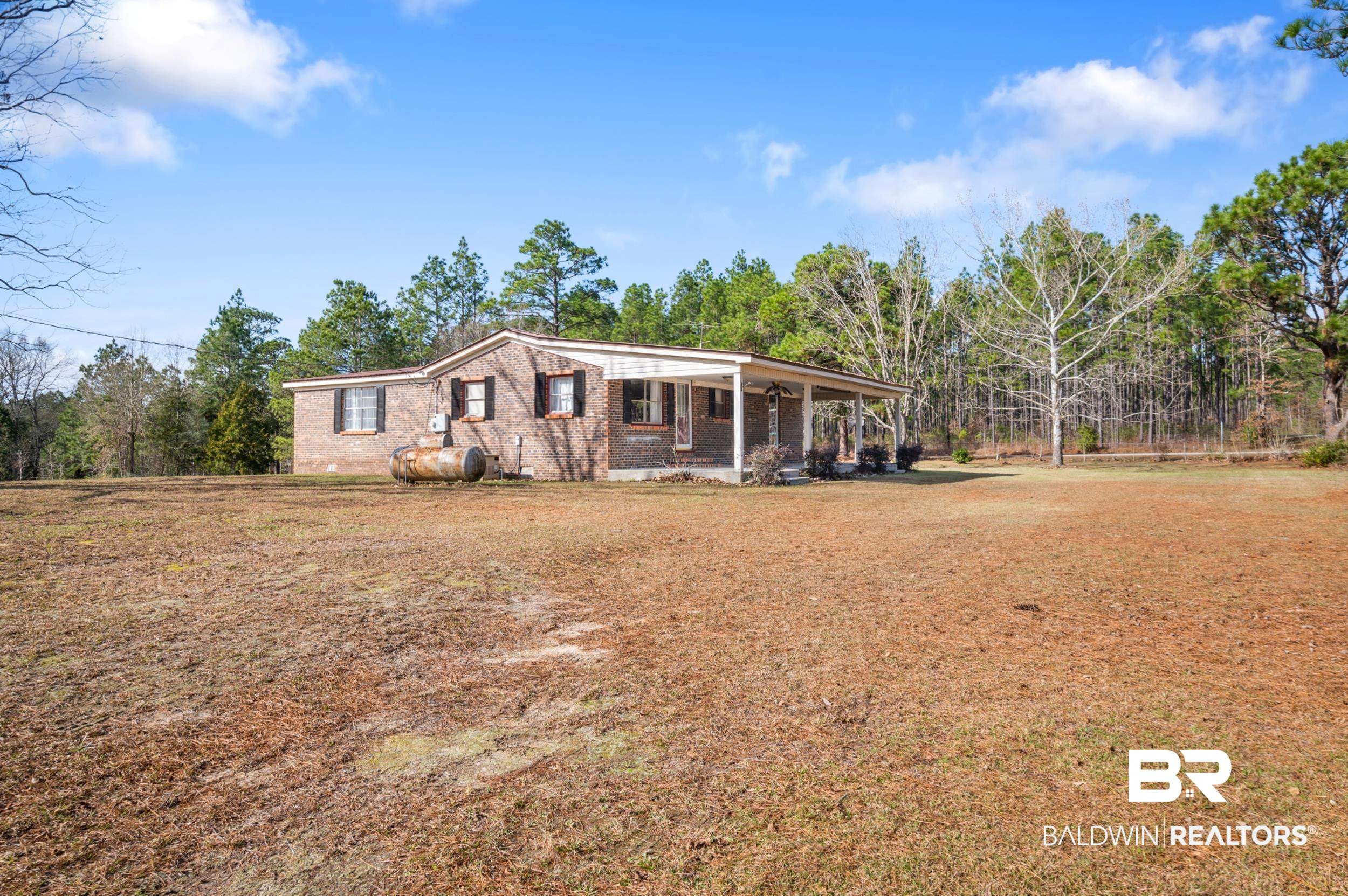 57623 Mary Hadley Road Perdido, AL 36562 - Photo 5 of 34 View of front of home featuring covered porch and a front yard