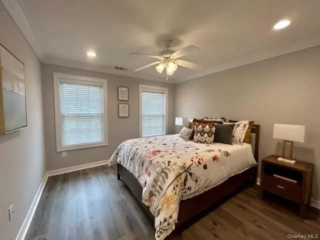 a bedroom with bed and window