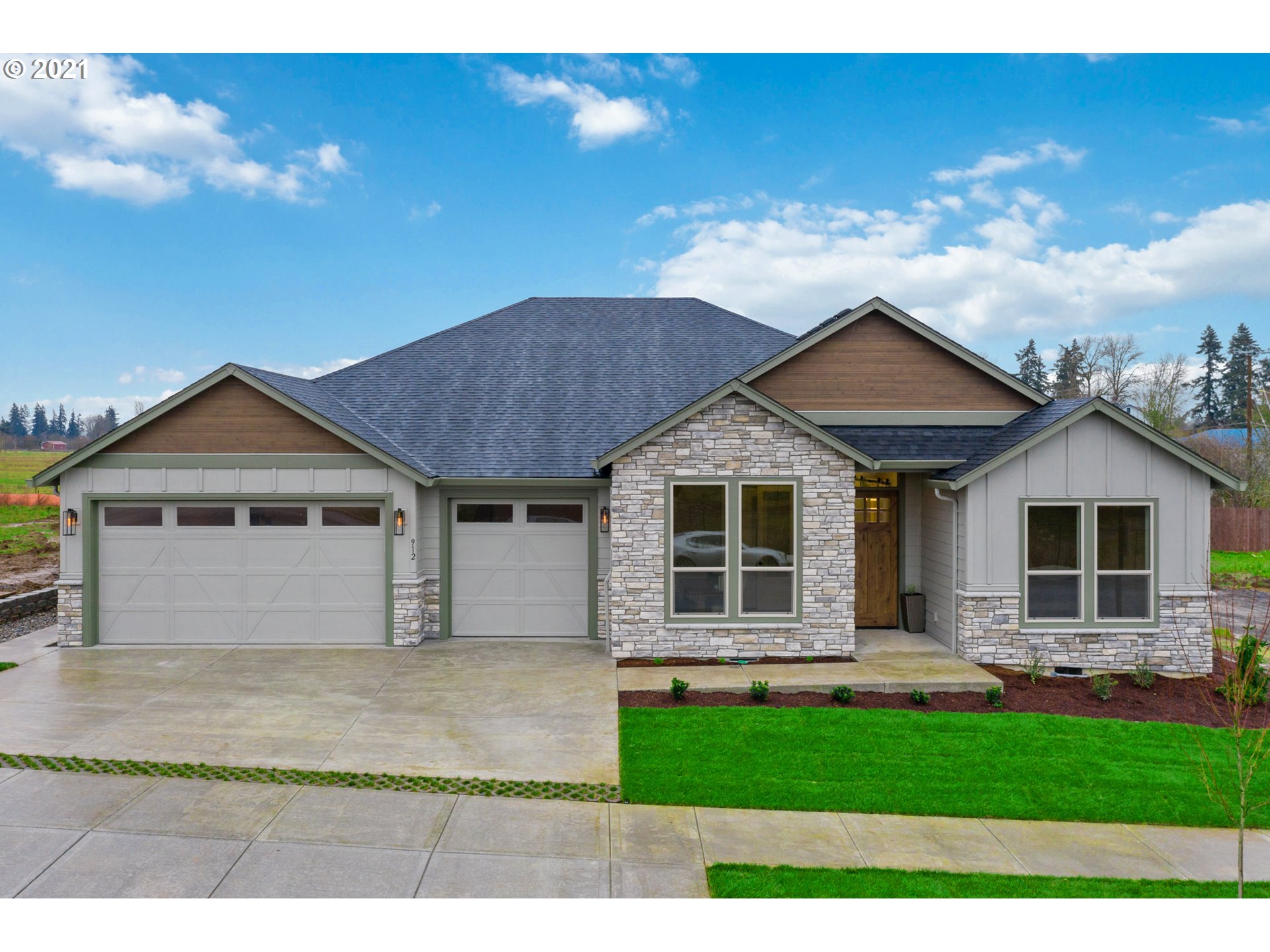 912 South 88th Avenue Ridgefield, WA 98642 - Photo 1 of 32 a front view of a house with a yard