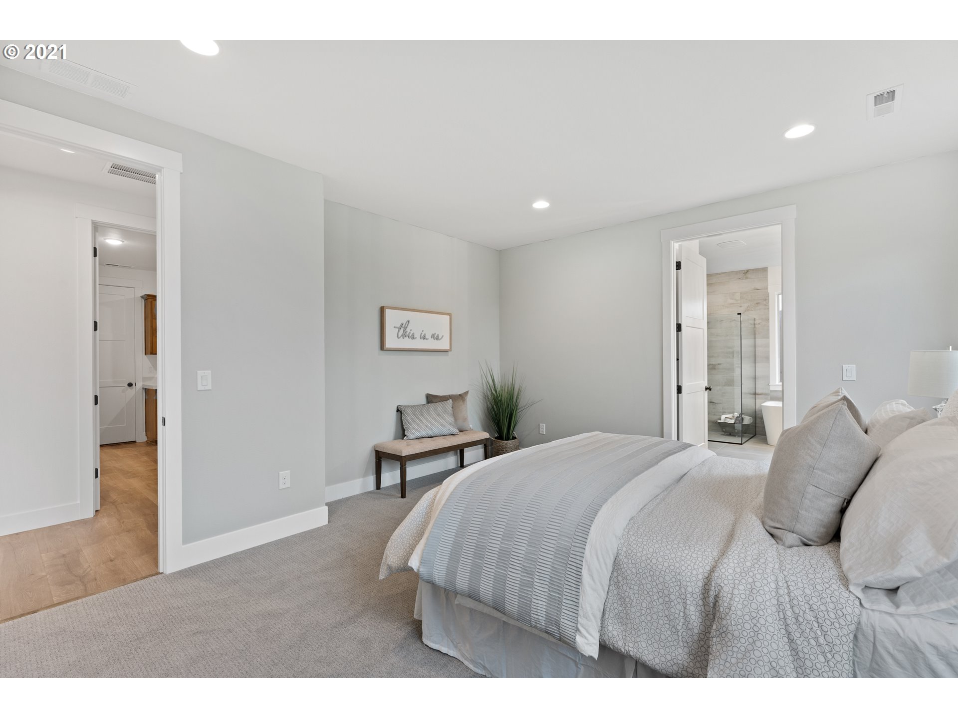 912 South 88th Avenue Ridgefield, WA 98642 - Photo 21 of 32 a bedroom with a bed and a view of bathroom
