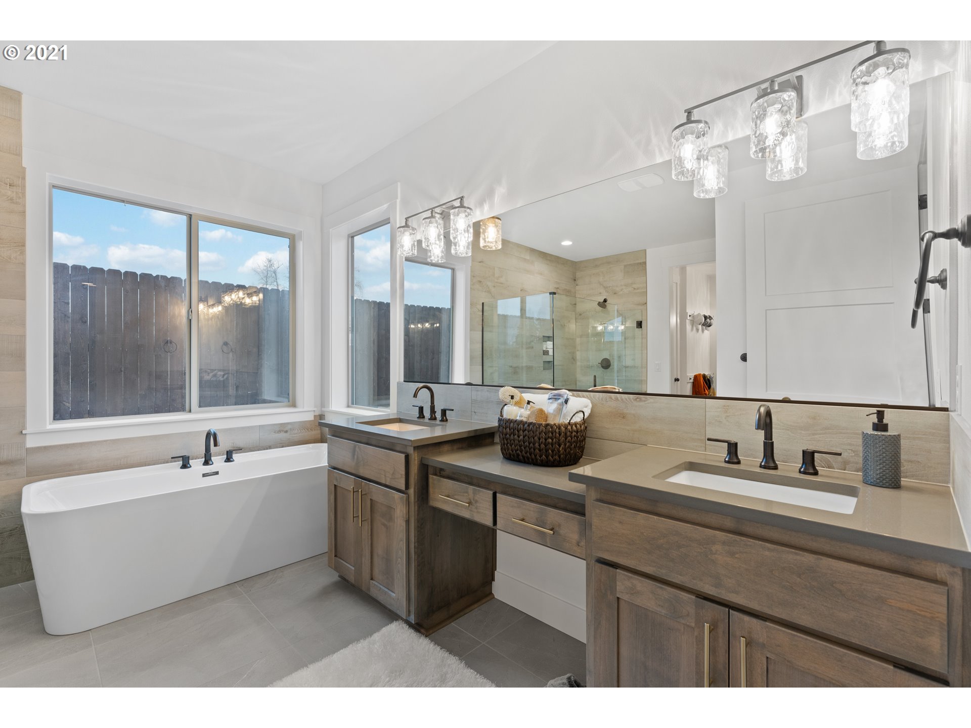 912 South 88th Avenue Ridgefield, WA 98642 - Photo 22 of 32 a bathroom with a double vanity sink mirror and bathtub