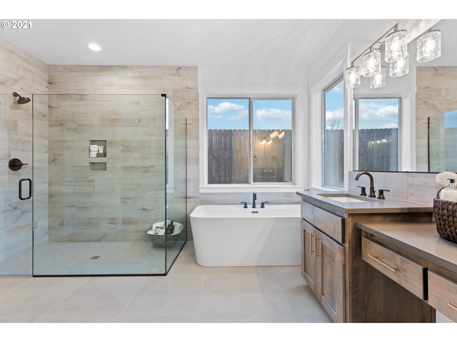 912 South 88th Avenue Ridgefield, WA 98642 - Photo 25 of 32 a bathroom with a tub sink mirror and a shower