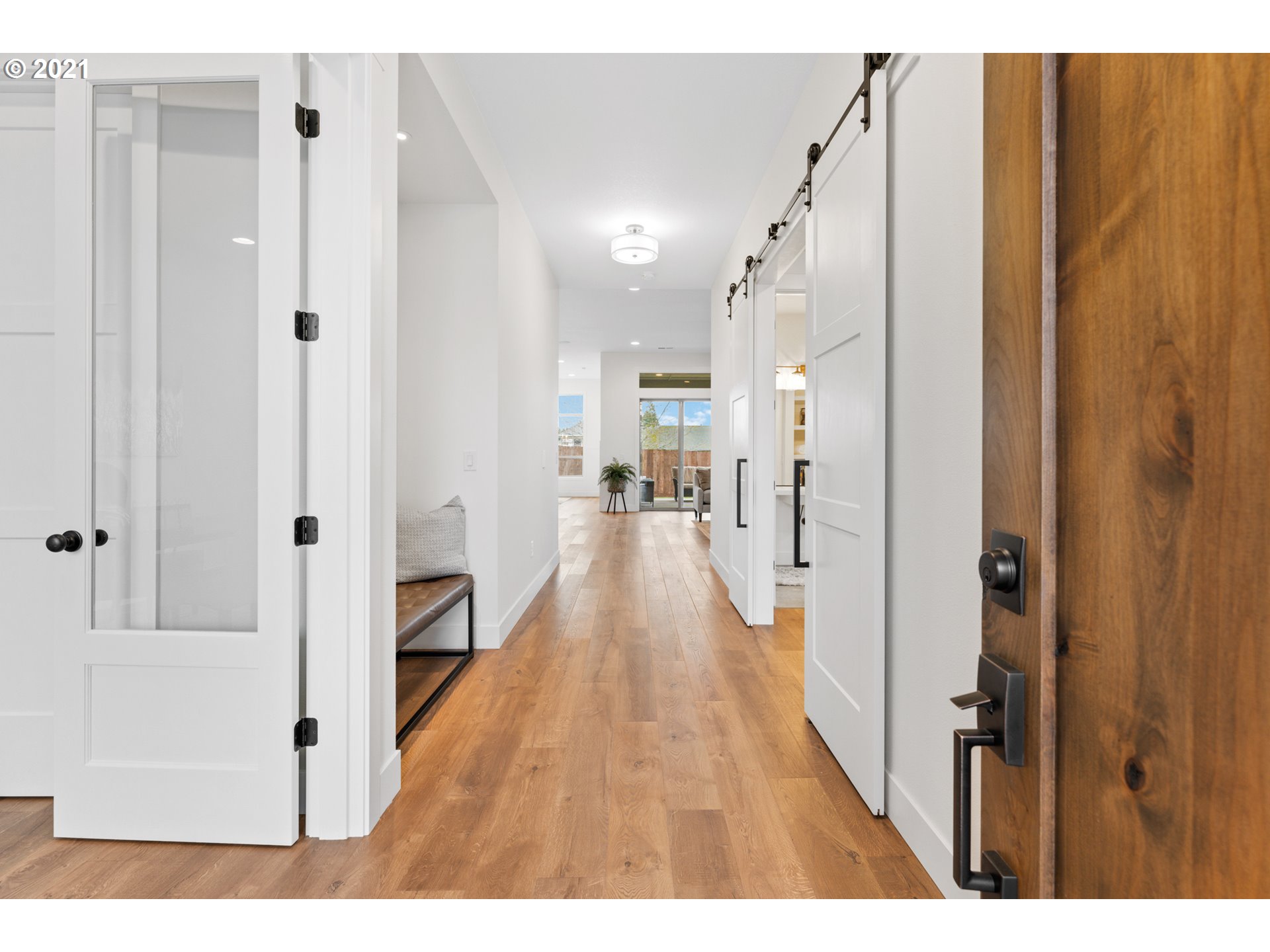 912 South 88th Avenue Ridgefield, WA 98642 - Photo 4 of 32 a view of a hallway with wooden floor and staircase