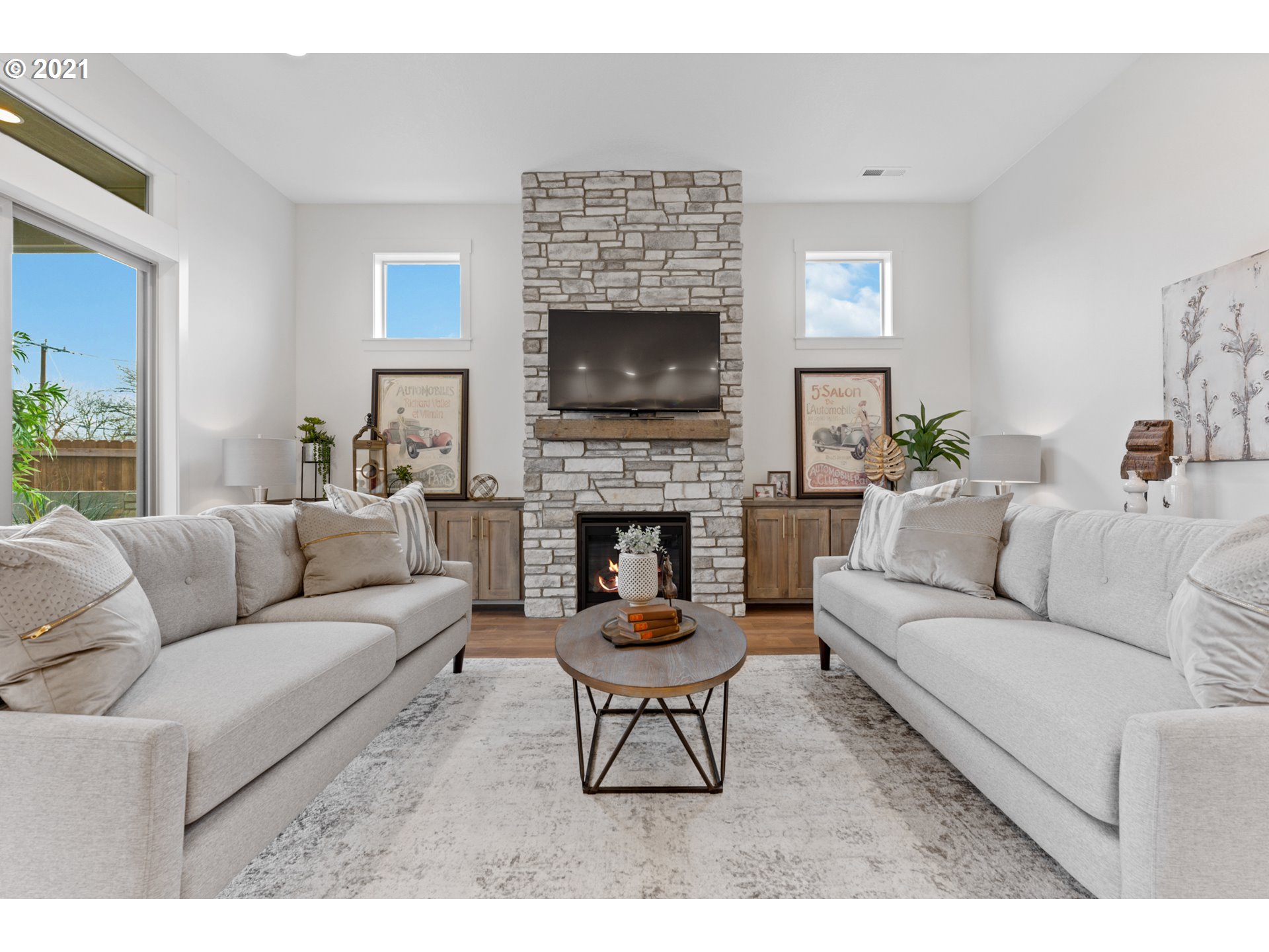912 South 88th Avenue Ridgefield, WA 98642 - Photo 6 of 32 a living room with furniture a fireplace and a flat screen tv