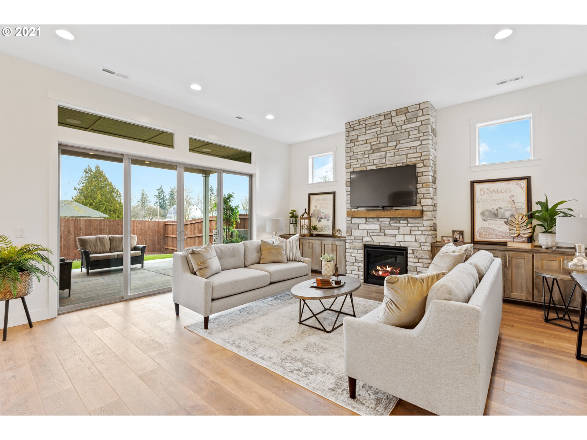 912 South 88th Avenue Ridgefield, WA 98642 - Photo 7 of 32 a living room with furniture a fireplace and a flat screen tv