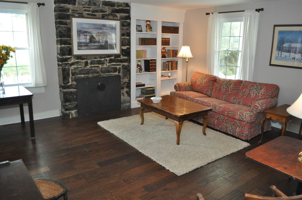 3994 Spring Hill Road Staunton, VA 24401 - Photo 13 of 41 a living room with furniture a flat screen tv and a fireplace