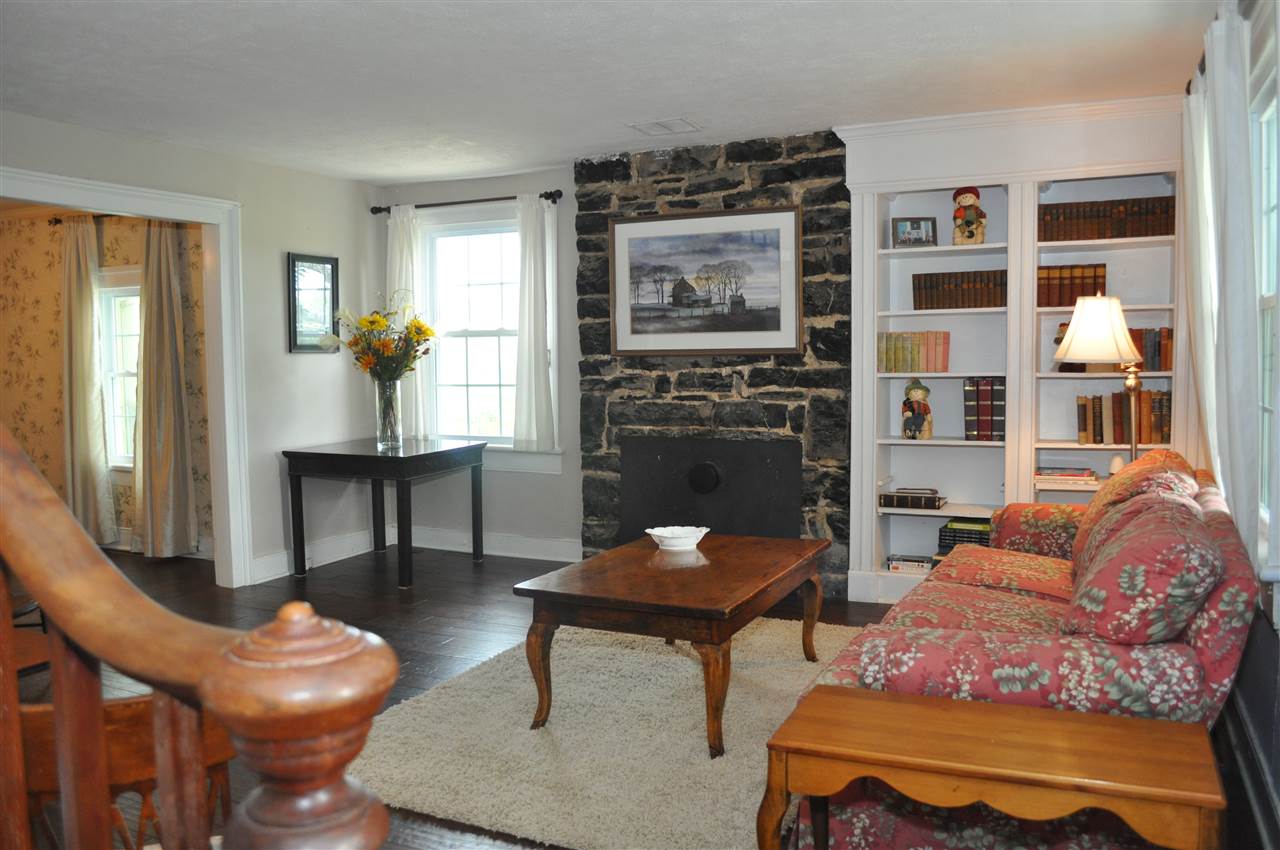 3994 Spring Hill Road Staunton, VA 24401 - Photo 15 of 41 a living room with furniture a rug and a fireplace