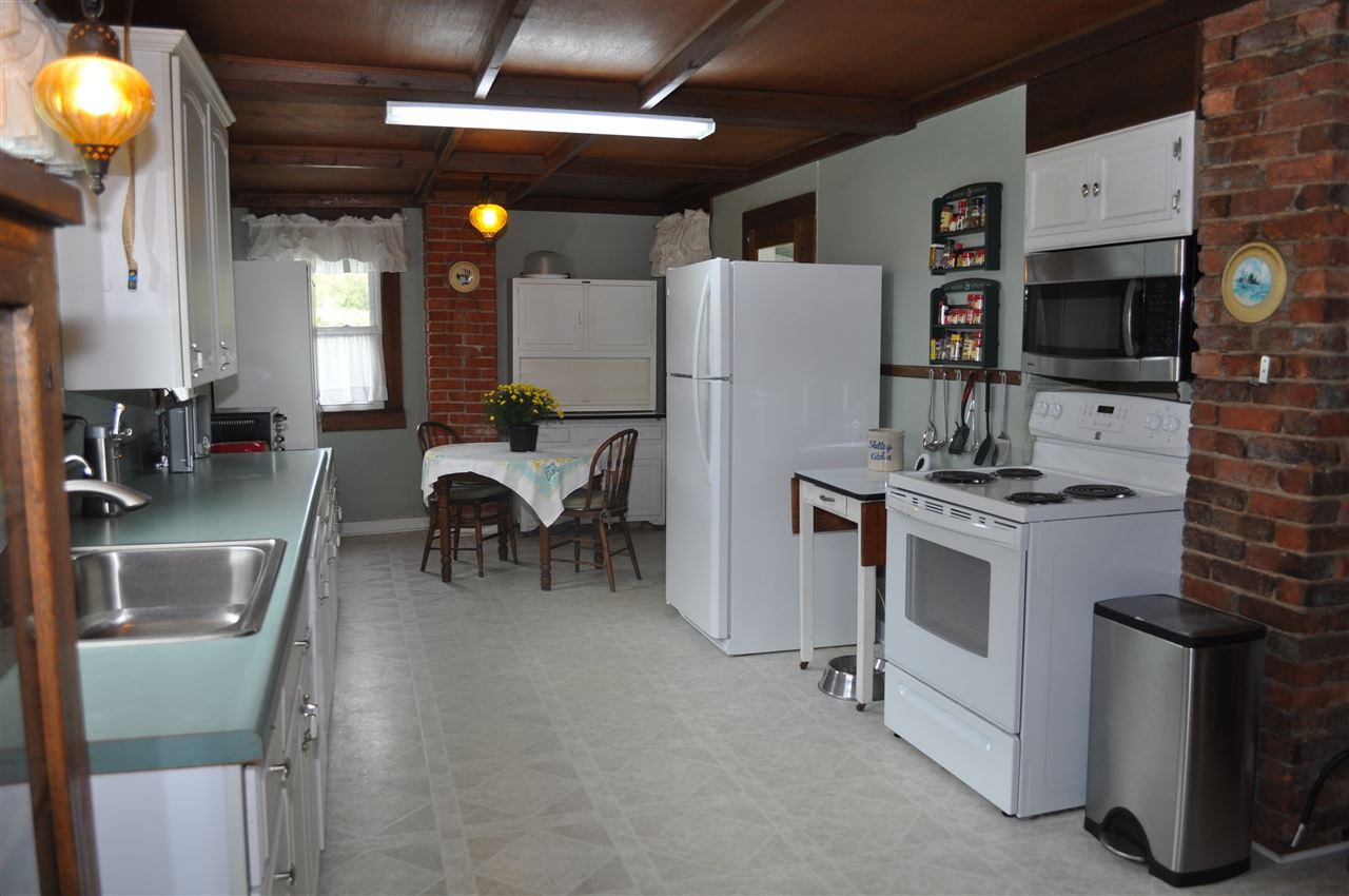 3994 Spring Hill Road Staunton, VA 24401 - Photo 20 of 41 a kitchen with refrigerator and stove