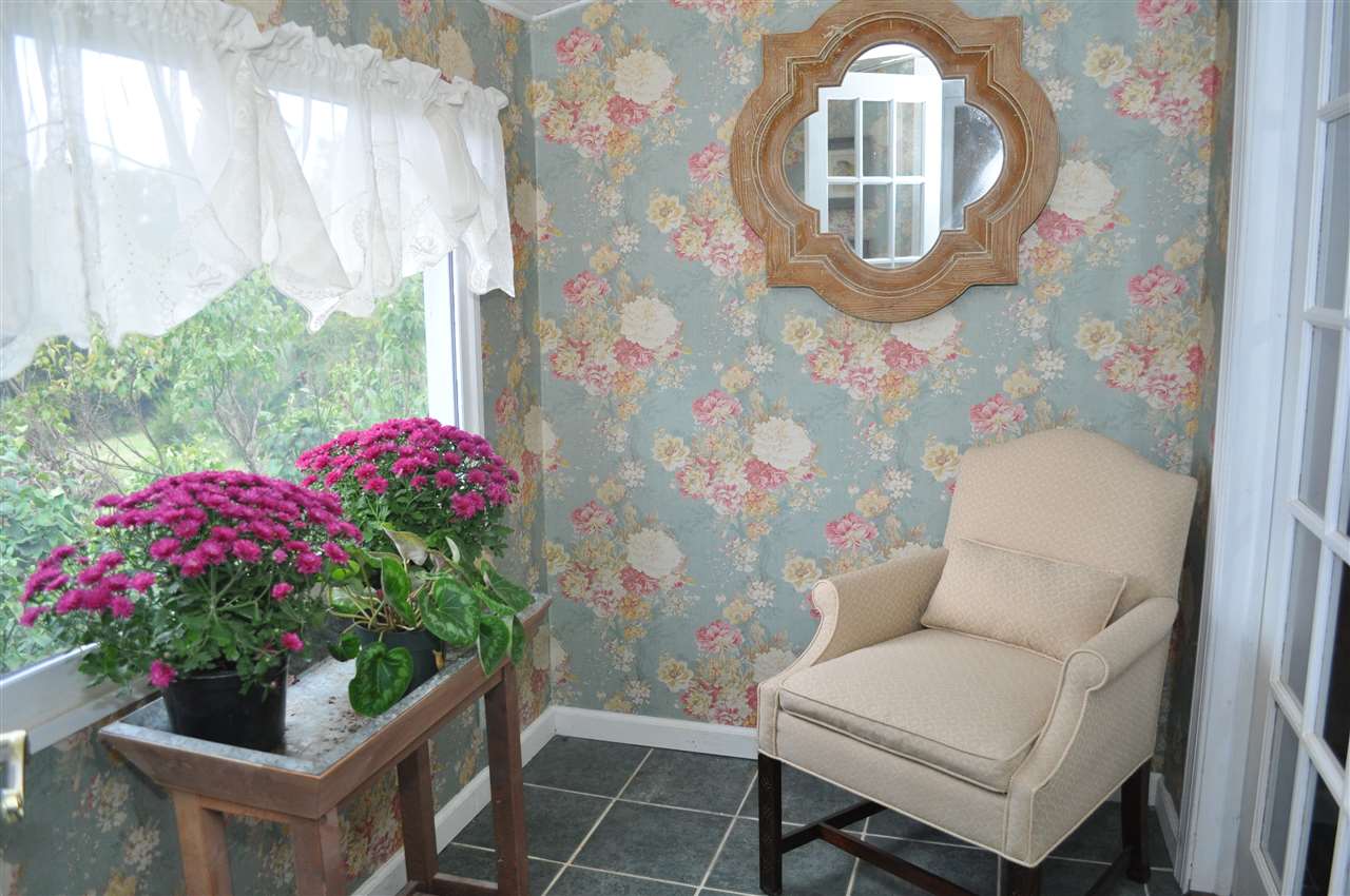 3994 Spring Hill Road Staunton, VA 24401 - Photo 26 of 41 a living room with furniture and flowers