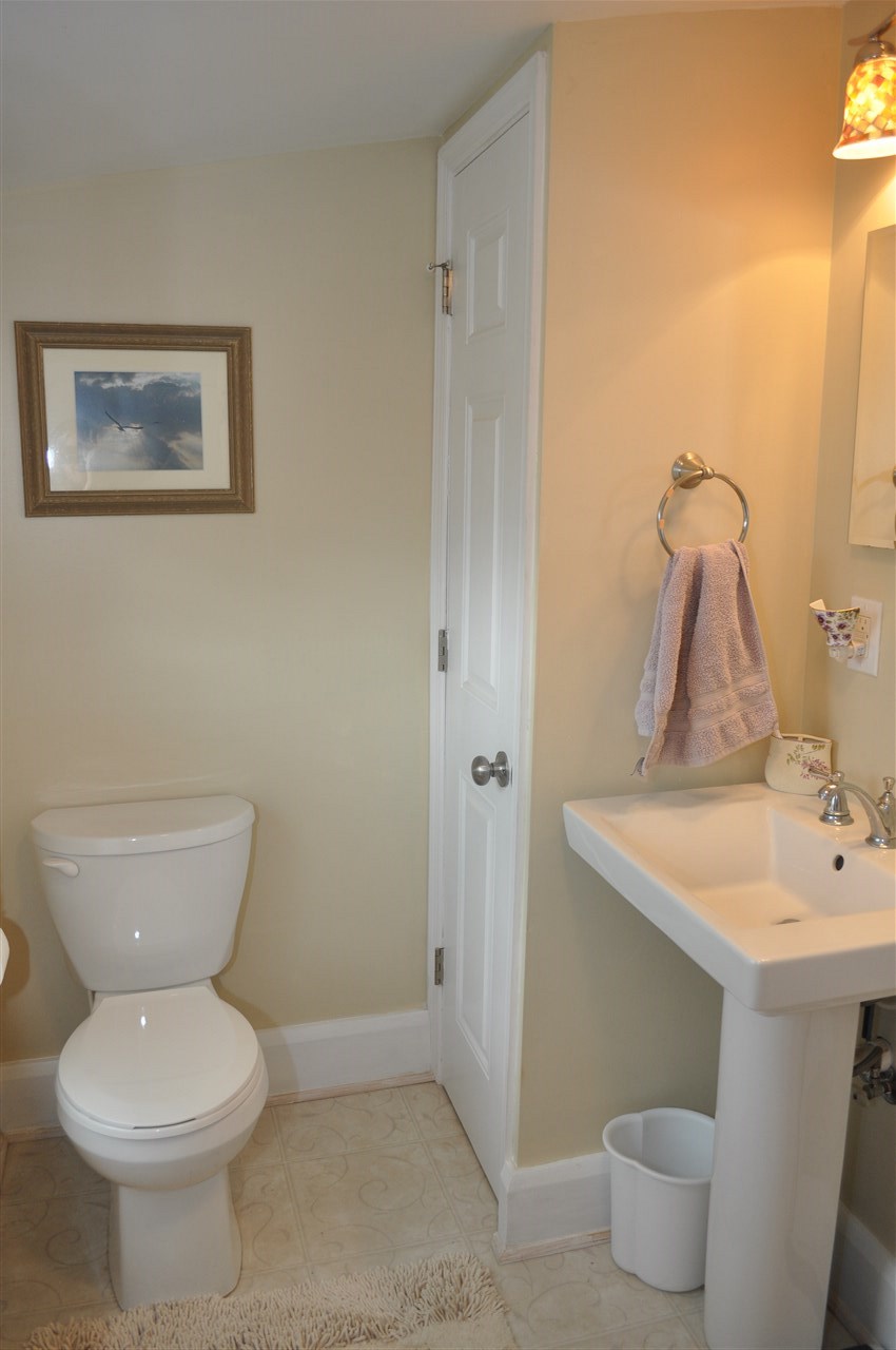 3994 Spring Hill Road Staunton, VA 24401 - Photo 33 of 41 a bathroom with a toilet sink and mirror