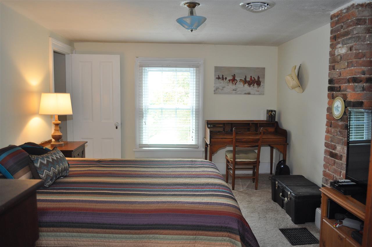 3994 Spring Hill Road Staunton, VA 24401 - Photo 34 of 41 a bedroom with a bed and a lamp on dresser