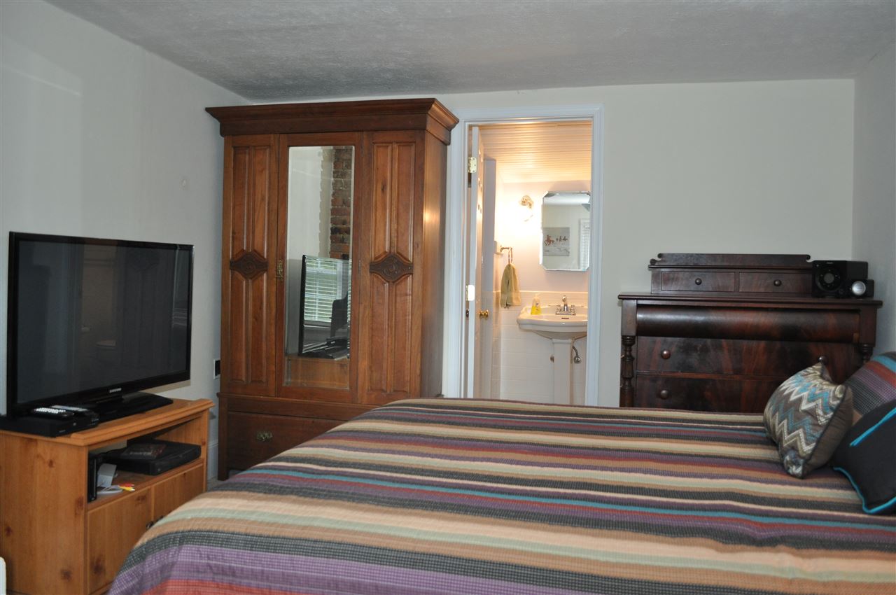 3994 Spring Hill Road Staunton, VA 24401 - Photo 35 of 41 a bedroom with a bed and a flat screen tv