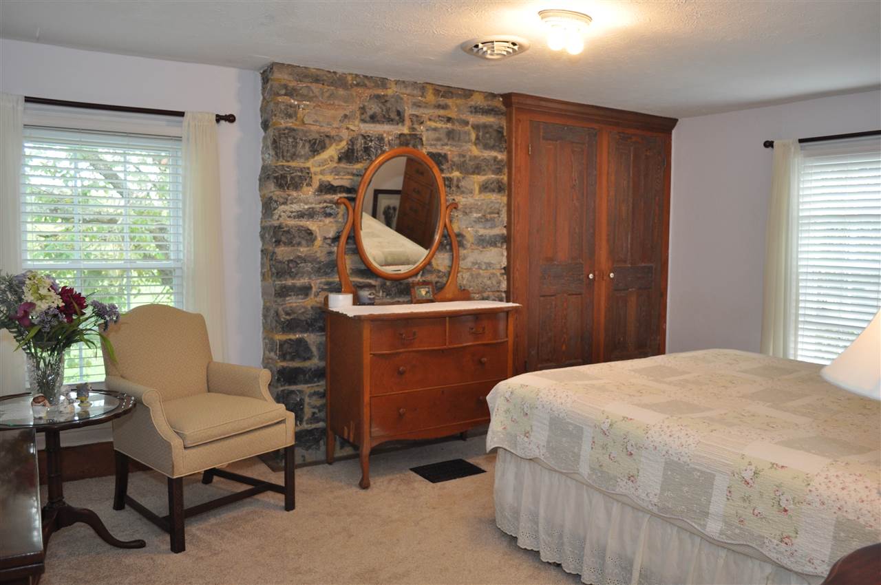 3994 Spring Hill Road Staunton, VA 24401 - Photo 36 of 41 a bedroom with a bed and furniture with window