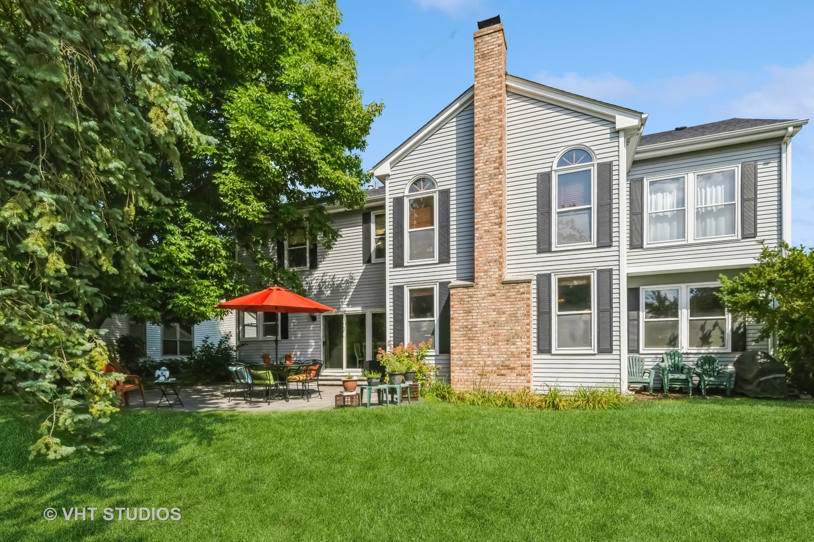 5149 Conifer Lane Gurnee, IL 60031 - Photo 14 of 18 a front view of house with yard and outdoor seating