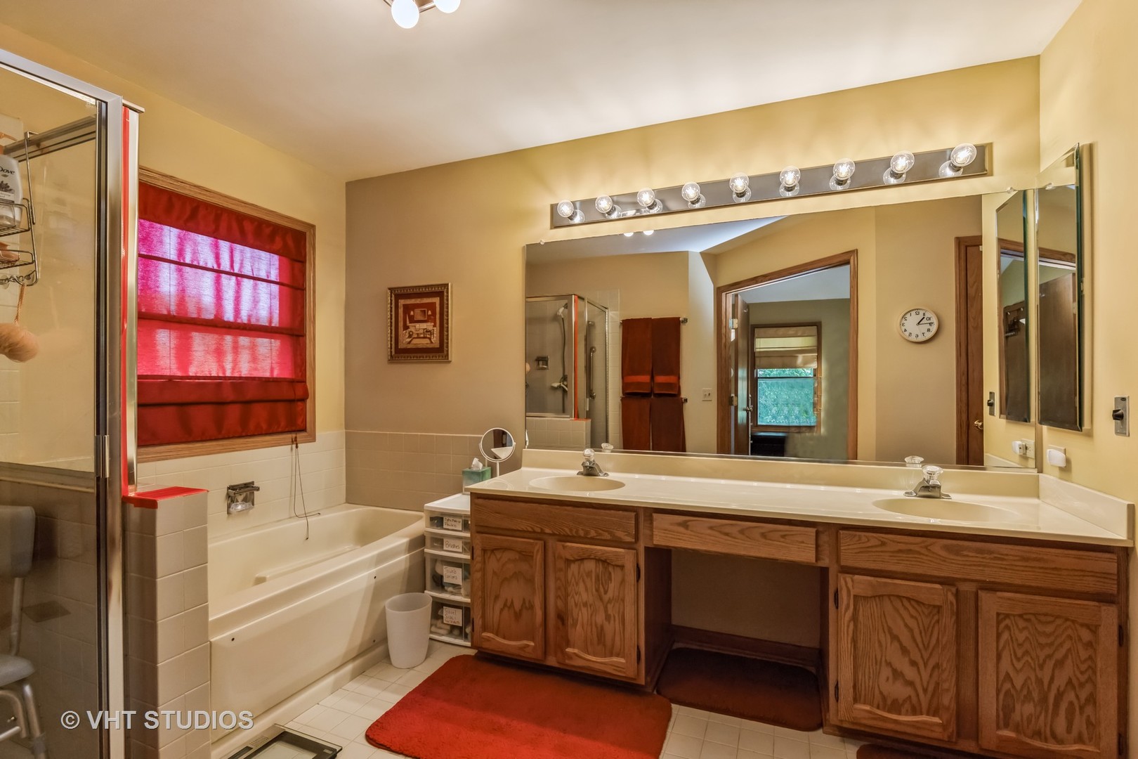 5149 Conifer Lane Gurnee, IL 60031 - Photo 9 of 18 a spacious bathroom with a granite countertop tub sink and mirror