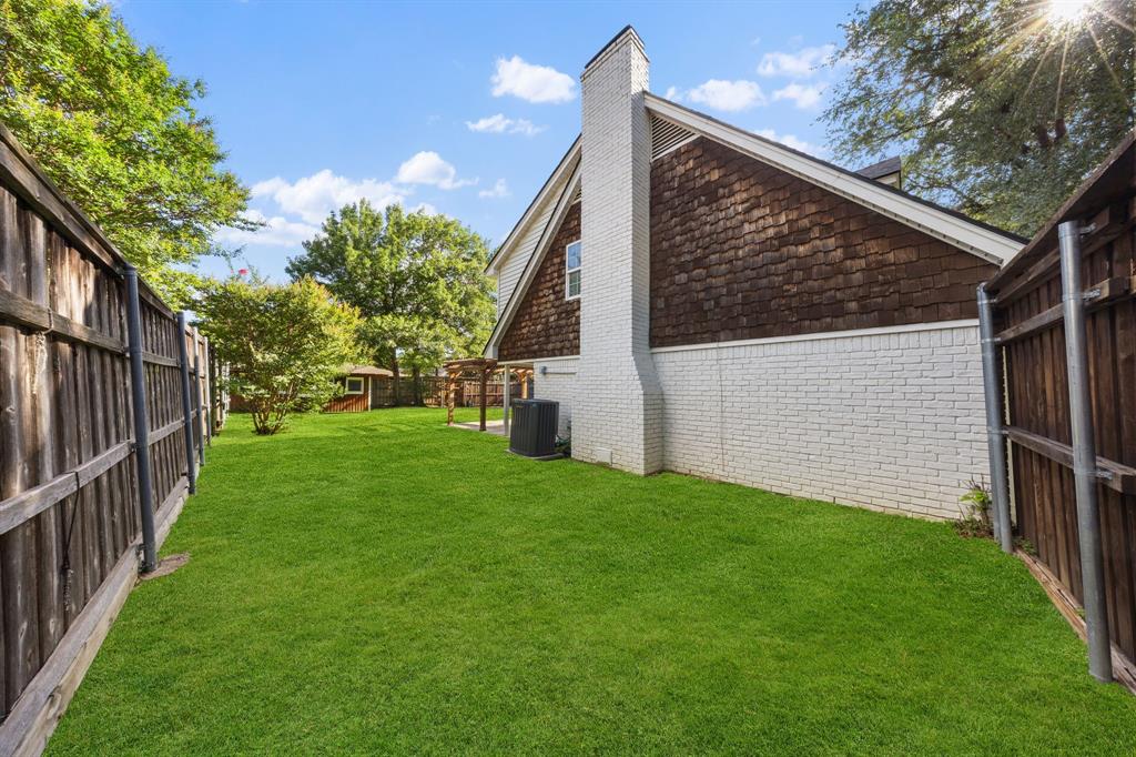 3060 Timberview Road Dallas, TX 75229 - Photo 30 of 39 Spacious side yard featuring a lush green lawn
