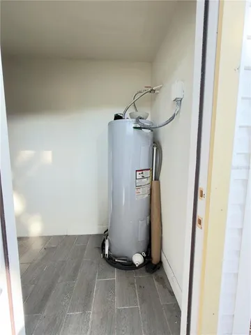 a view of yard with tree and wooden fence