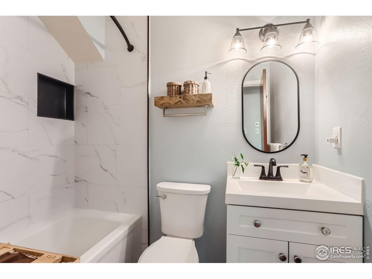 3075 Edison Court Boulder, CO 80301 - Photo 15 of 28 a bathroom with a sink mirror and toilet