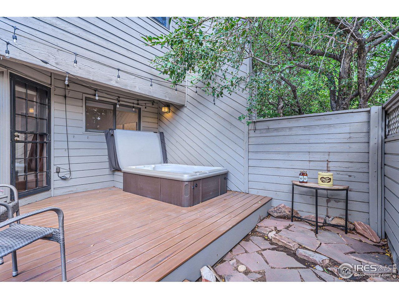 3075 Edison Court Boulder, CO 80301 - Photo 22 of 28 a view of backyard with a table and chairs and wooden floor