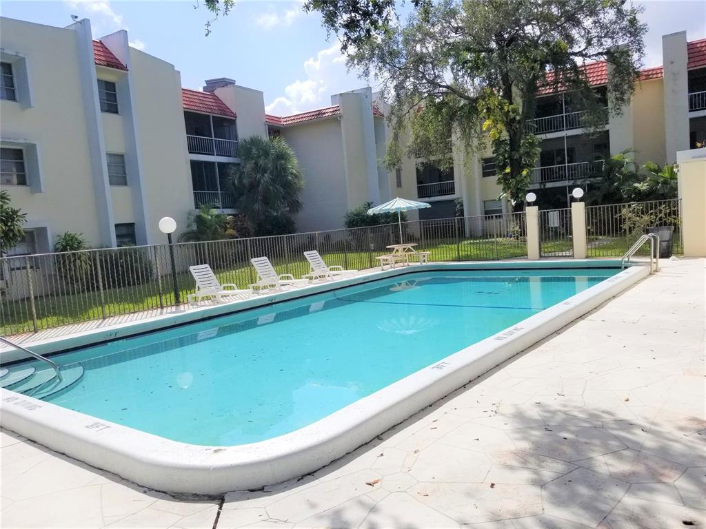 642 Northwest 13th Street, Unit 24 Boca Raton, FL 33486 - Photo 2 of 9 a view of swimming pool