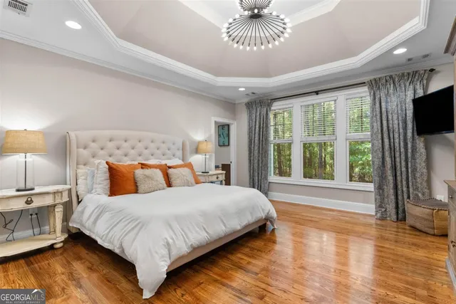 a bathroom with a granite countertop sink a mirror and a shower