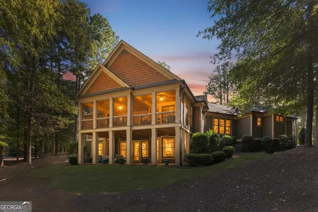 a front view of a house with outdoor seating and plants