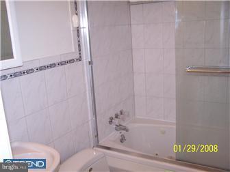 891 Morefield Road Philadelphia, PA 19115 - Photo 11 of 12 a bathroom with a bathtub and shower