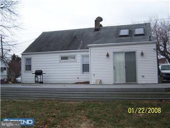 891 Morefield Road Philadelphia, PA 19115 - Photo 7 of 12 a front view of a house with a garden