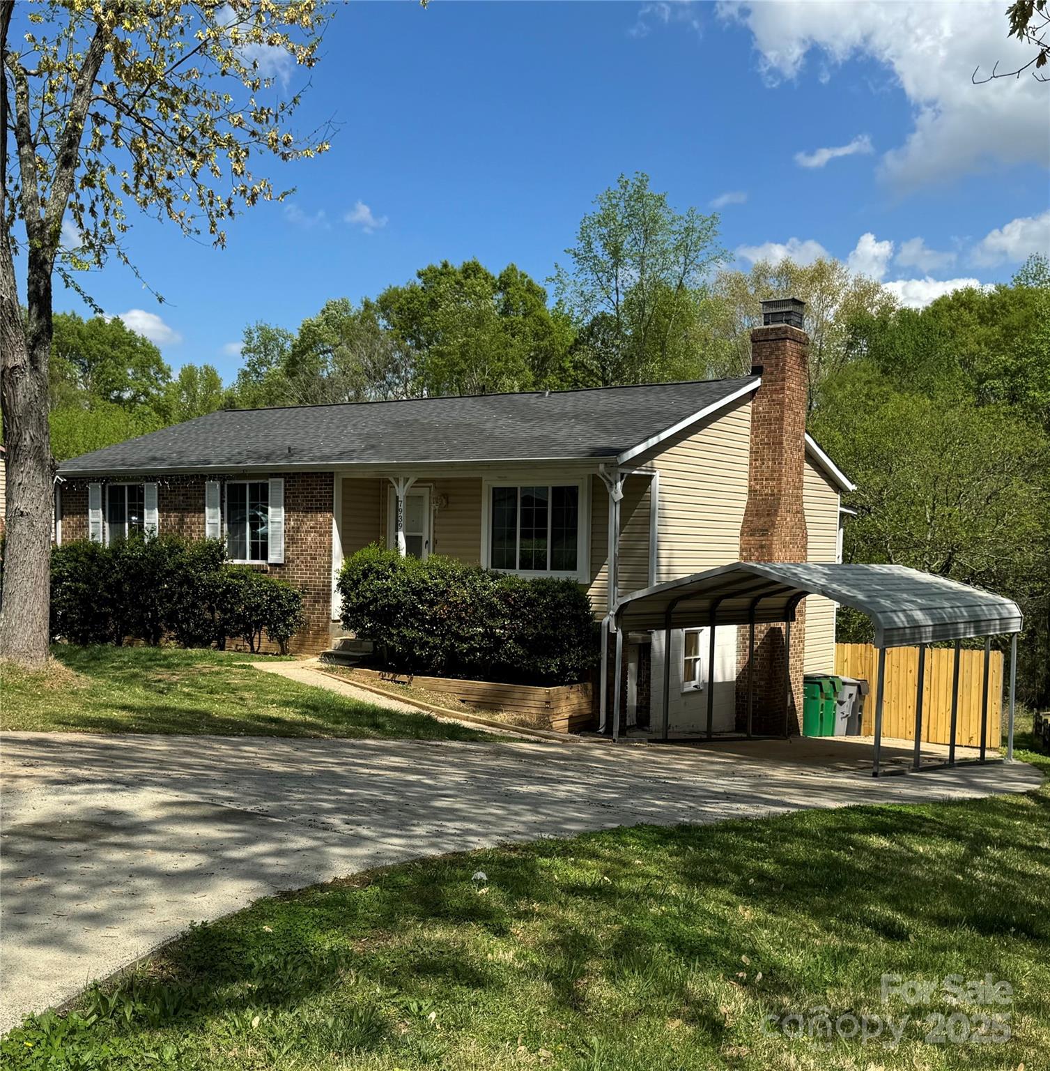 7939 Holly Hill Road Charlotte, NC 28227 - Photo 2 of 38 a front view of a house with a yard