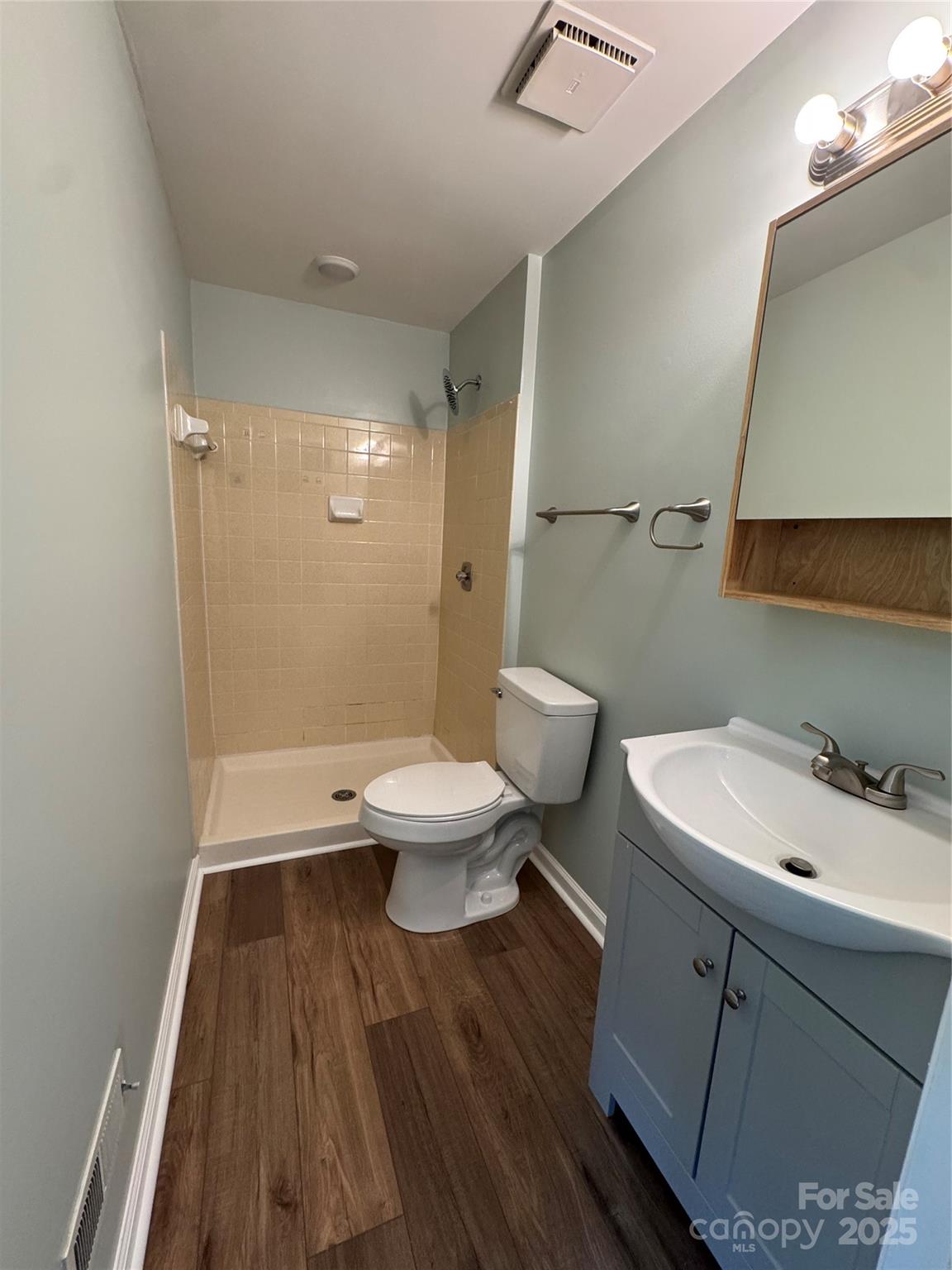 7939 Holly Hill Road Charlotte, NC 28227 - Photo 27 of 38 a bathroom with a sink and a toilet