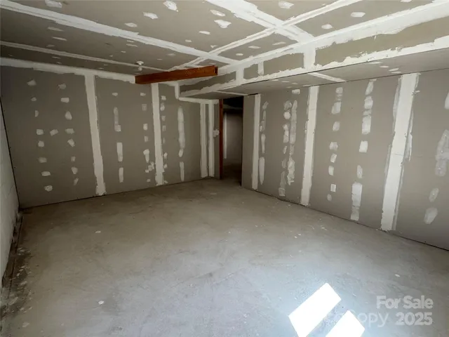 a swimming pool with trees in the background