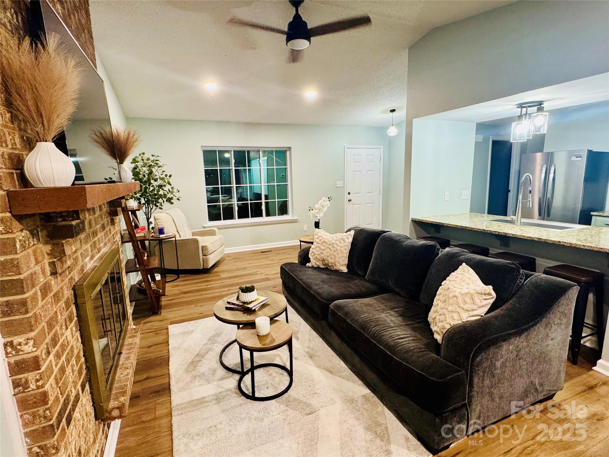 7939 Holly Hill Road Charlotte, NC 28227 - Photo 7 of 38 a living room with furniture and a large window