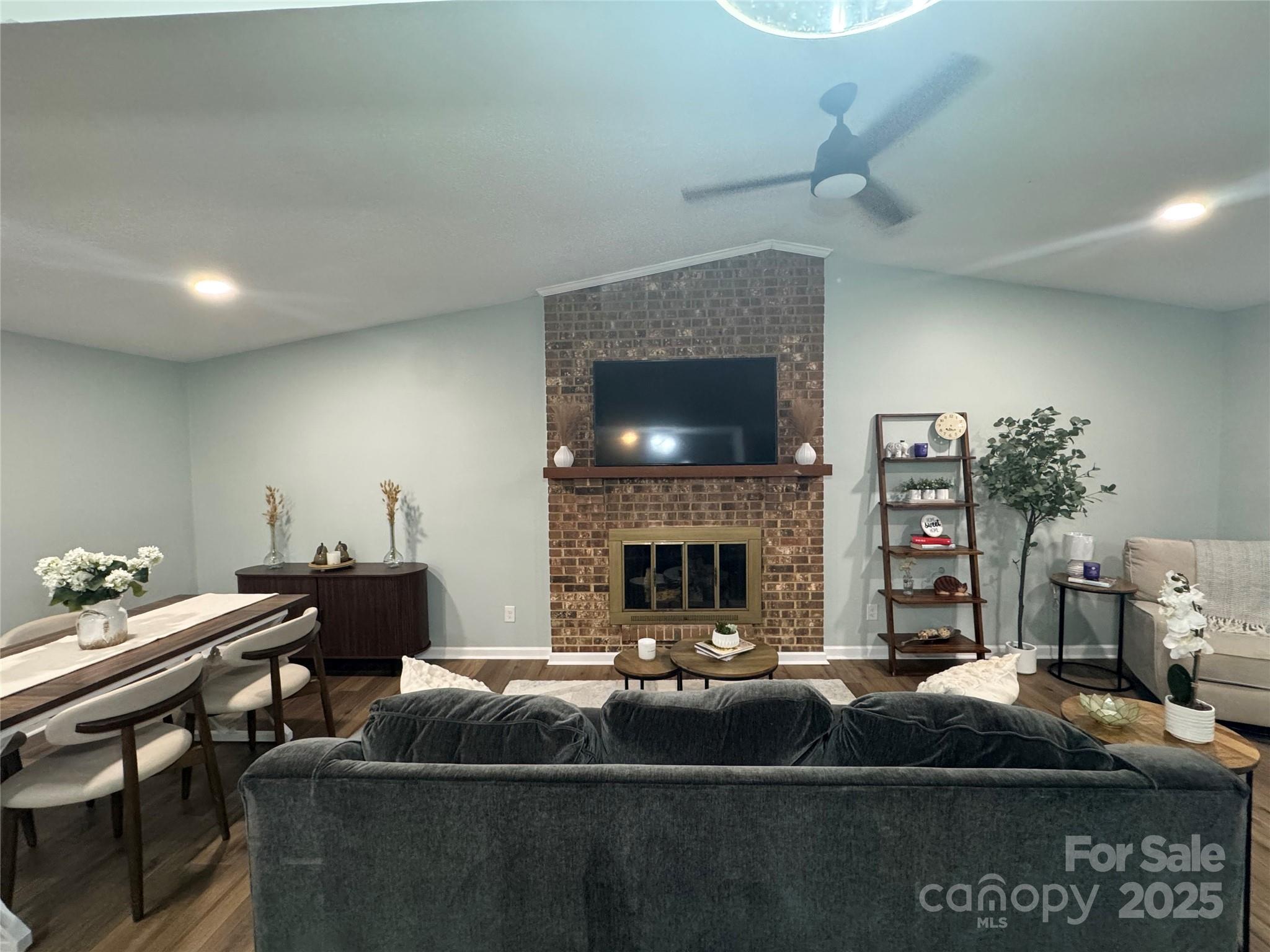 7939 Holly Hill Road Charlotte, NC 28227 - Photo 10 of 38 a living room with furniture and a fireplace