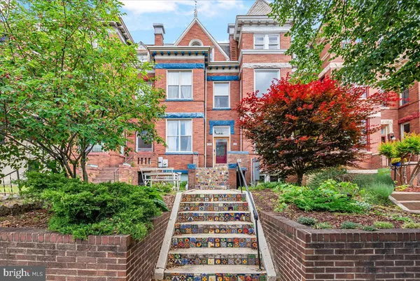 a front view of a multi story residential apartment buildings