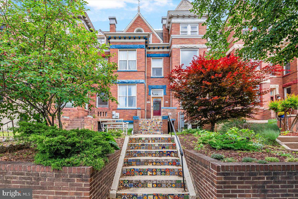 a front view of a multi story residential apartment buildings