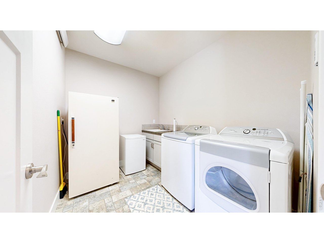 296 Elkridge Road Red Feather Lakes, CO 80545 - Photo 28 of 47 Basement laundry room, with utility sink, washer, dryer and freezer all included