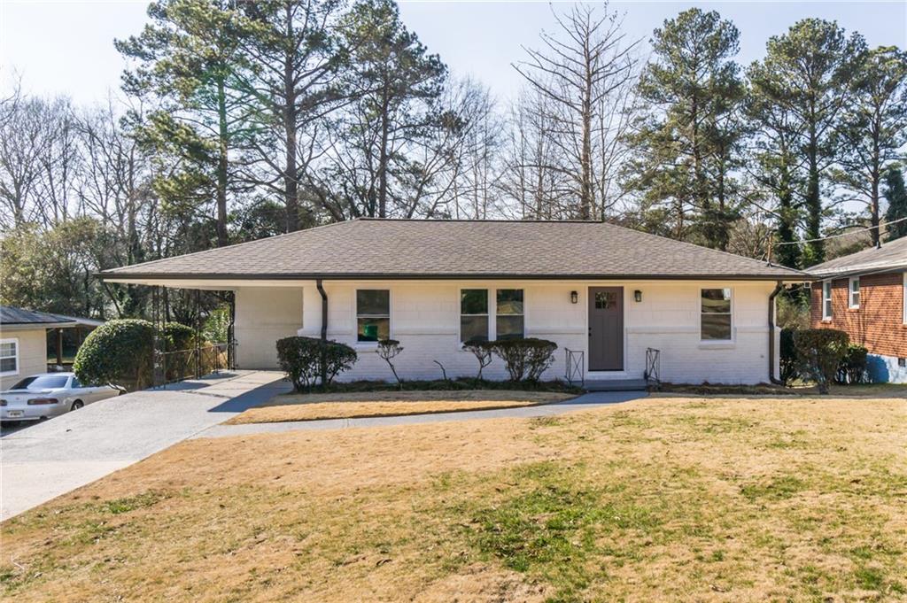 1721 McKenzie Drive Decatur, GA 30032 - Photo 1 of 1 a front view of house with yard outdoor seating and patio