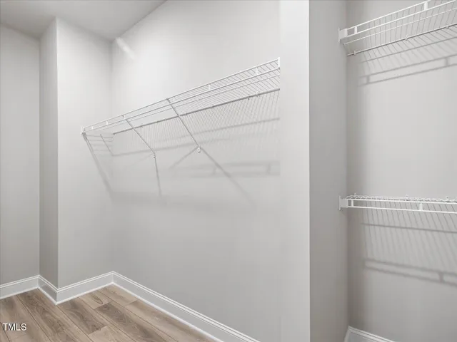 a view of an empty walk in closet