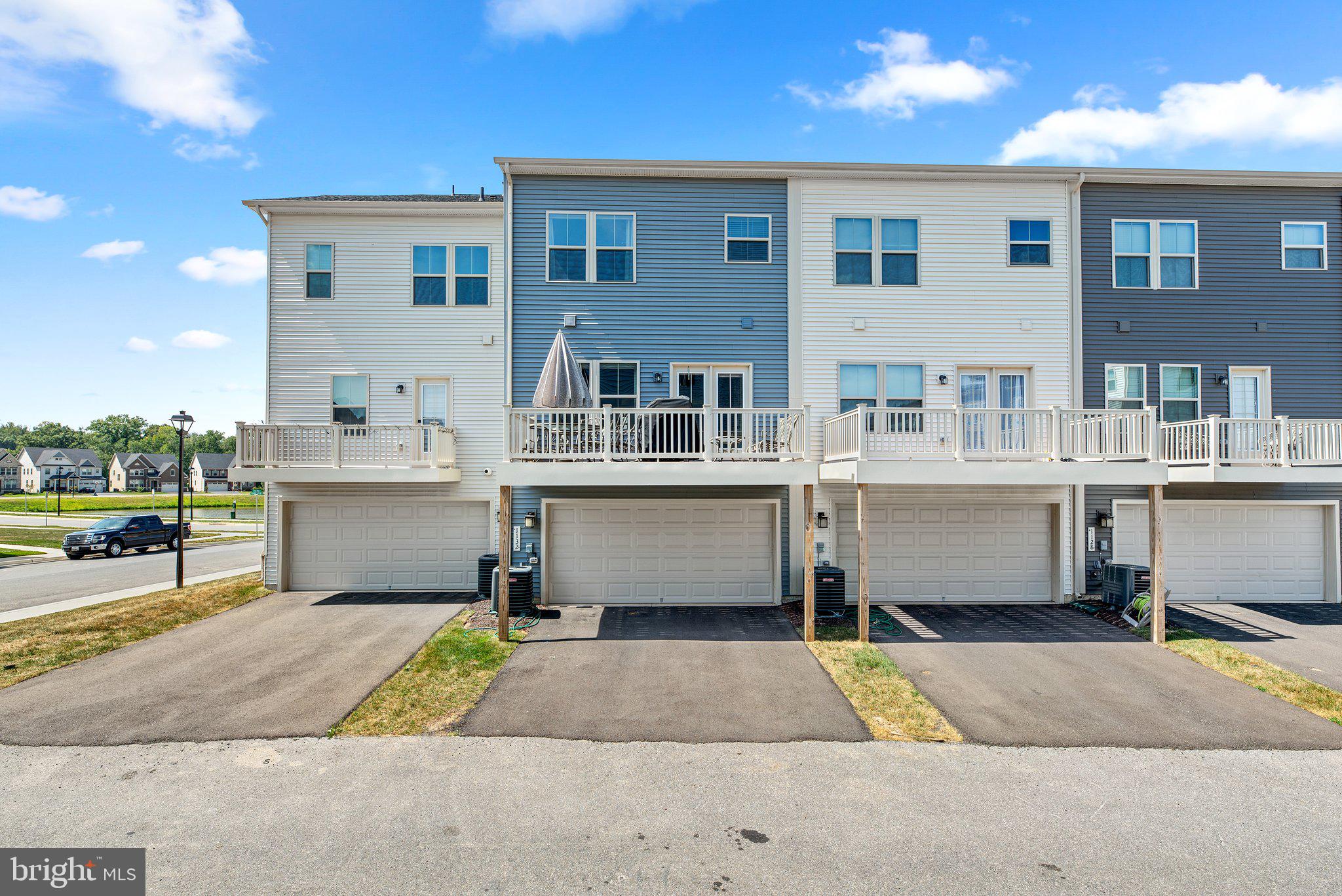 1132 Patuxent Greens Drive Laurel, MD 20708 - Photo 37 of 44 Rear of Home Garage Entry/Driveway + Side Street