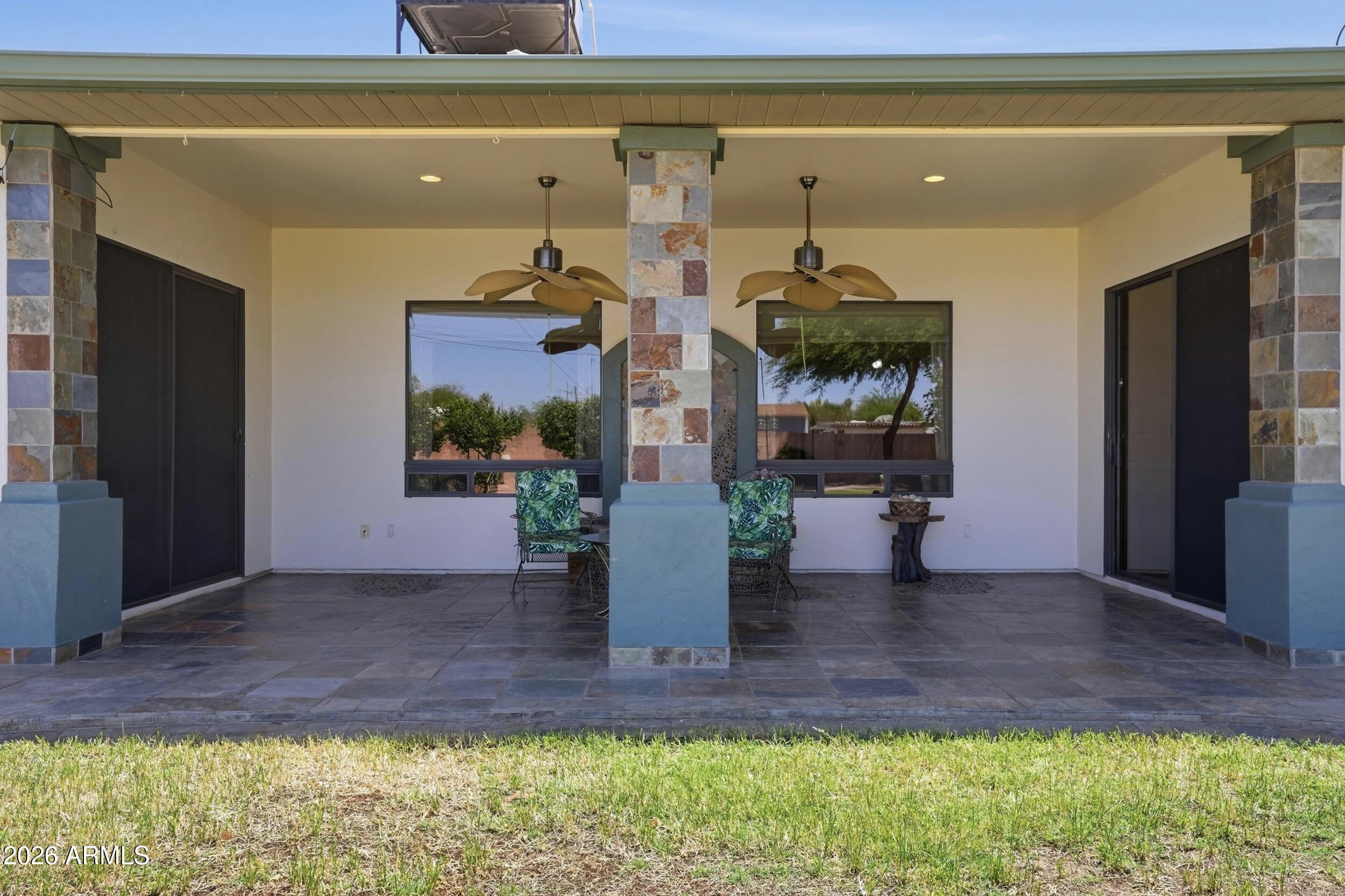 6334 East Albany Street Mesa, AZ 85205 - Photo 46 of 72 a front view of a house with a yard