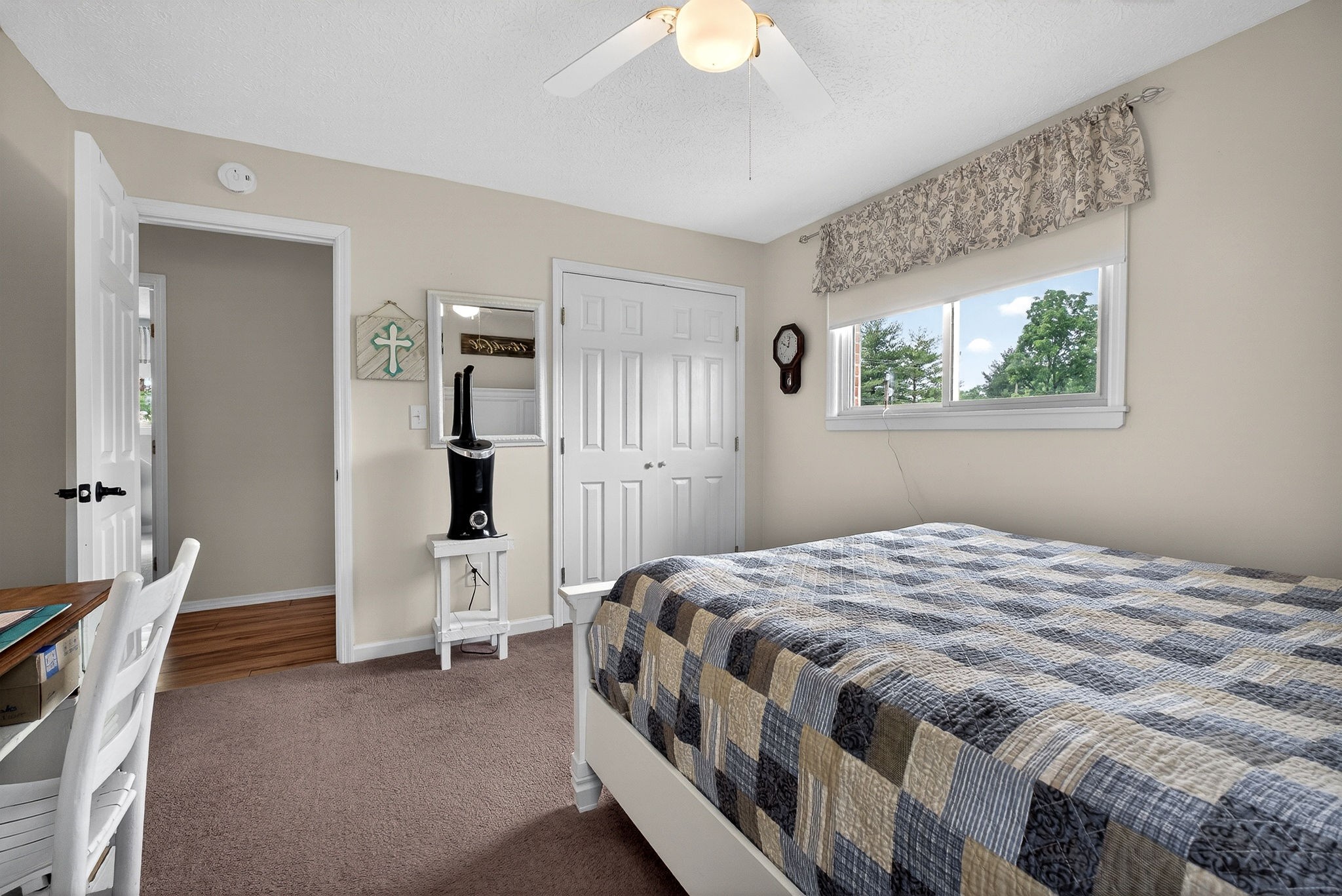 1755 Burgess Falls Road Sparta, TN 38583 - Photo 37 of 56 a bedroom with a bed and a chandelier