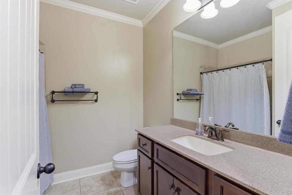 1301 Conser Street Collierville, TN 38017 - Photo 21 of 39 a bathroom with a granite countertop sink toilet and mirror