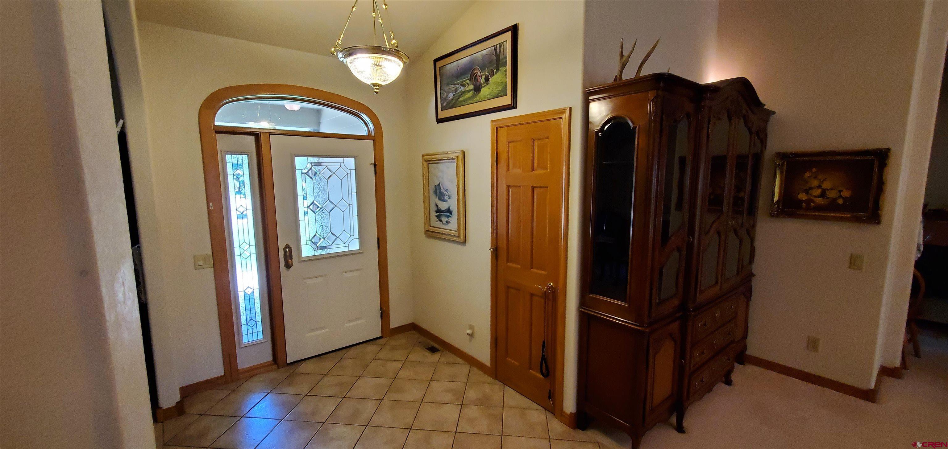 370 Red Rock Road Durango, CO 81301 - Photo 11 of 25 a view of a entryway door with wooden floor