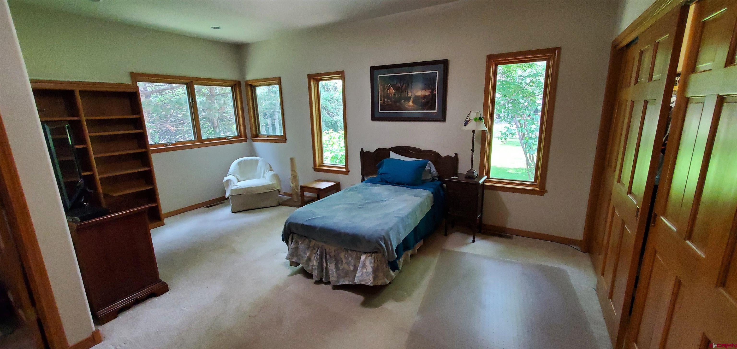 370 Red Rock Road Durango, CO 81301 - Photo 22 of 25 a room with furniture and a window